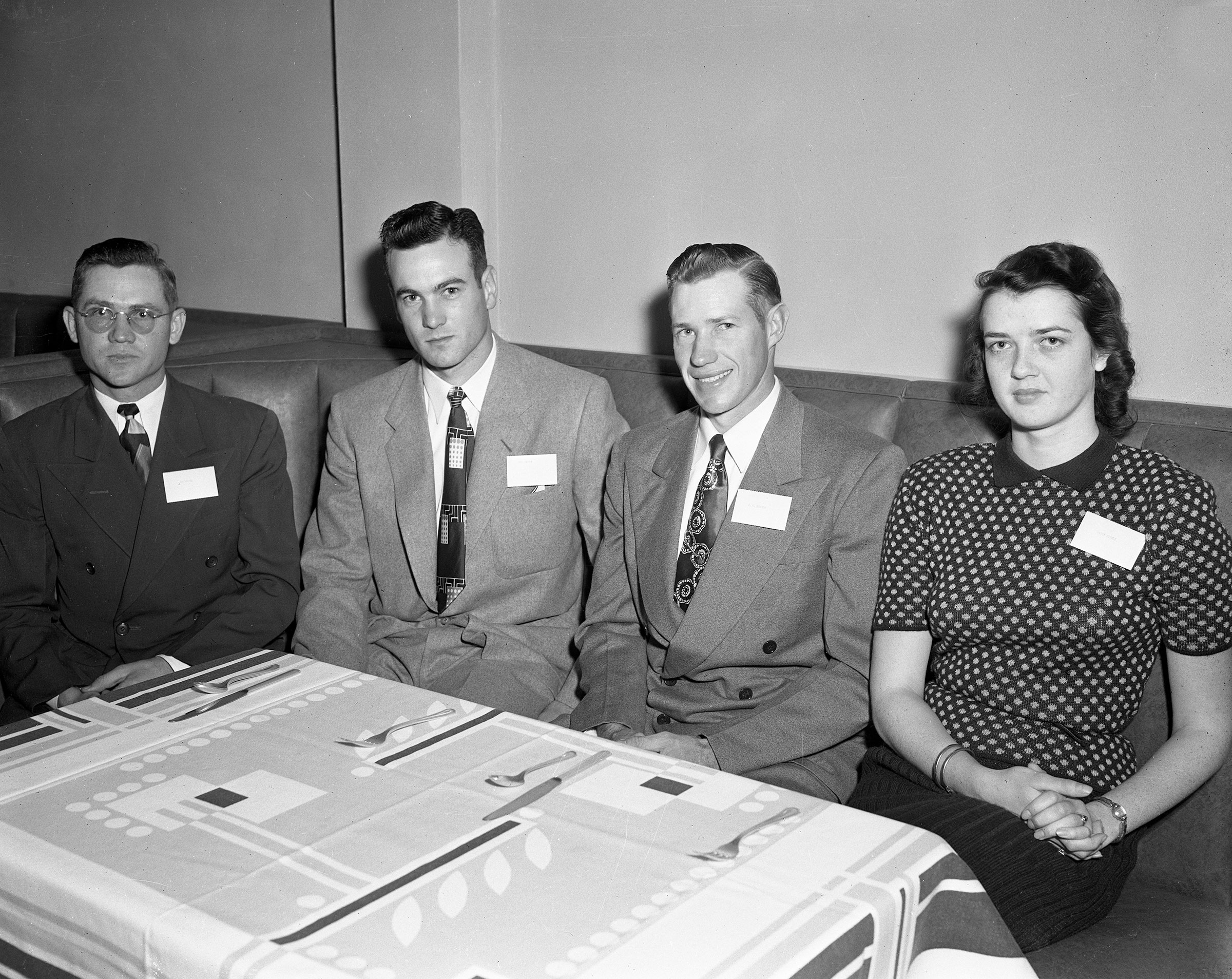 During the Cleveland County Junior Farm Bureau organizational banquet in Norman in 1953, more than 50 members selected officers to lead their newly formed group. The officers elected were (left to right) Joe Merkle and Bob Bates, Vice Presidents; J.C. Shroyer, President; and Patsy Steele, Secretary.