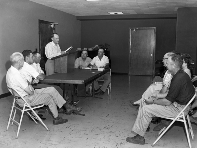 Members were faced with a highly divisive issue in the early days of Oklahoma Farm Bureau: commodity price supports. Several counties, such as Comanche County pictured here, held a series of debates on the issue to encourage members to research and present their opinions on the matter. This photo, taken in 1953, includes (left to right) Homer Turner, Charles Hasenbeck, Paul Scheetz, Charlie Bard, Stanley Caha and Elbrege Sullivan.