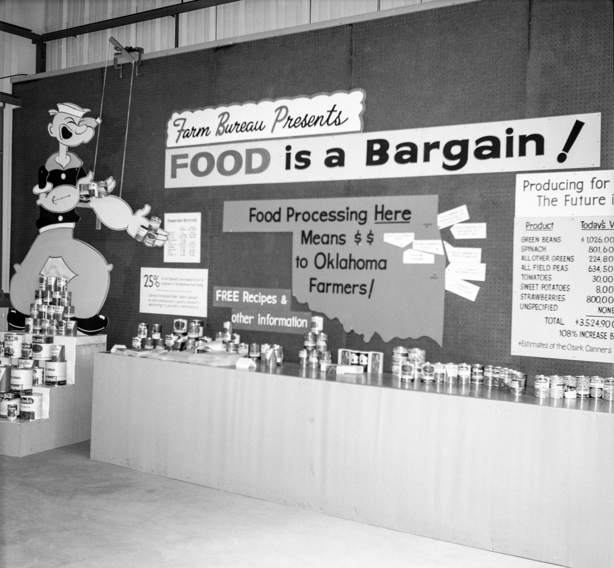This booth was assembled at the Oklahoma City Fair in 1964. “Food is a Bargain” was the theme for the booth, presenting a story on a truth of Oklahoma agriculture that many consumers did not understand: a story detailing the economic impact of vegetables grown in Oklahoma and processed in the state and western Arkansas.
