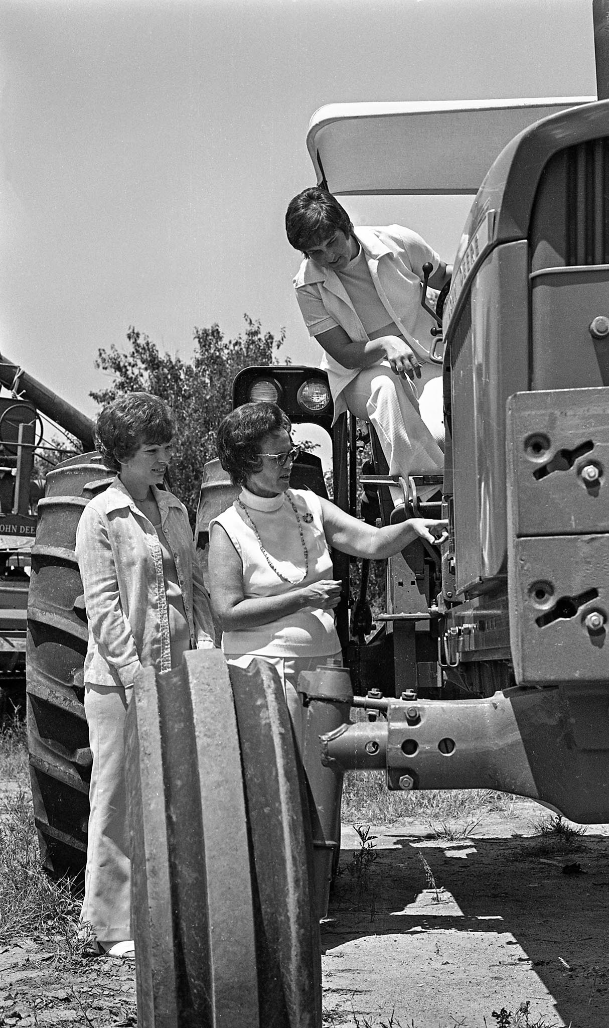 On September 4, 1975, the Noble County’s WLC conducted a Ladies Tractor Driving School at the county fairgrounds. This photo shows Mrs. Ronnie Golliver, Chairman; Mrs. David Sherrard, Vice Chairman; and Mrs. John Main, Secretary, planning subject material for the school.