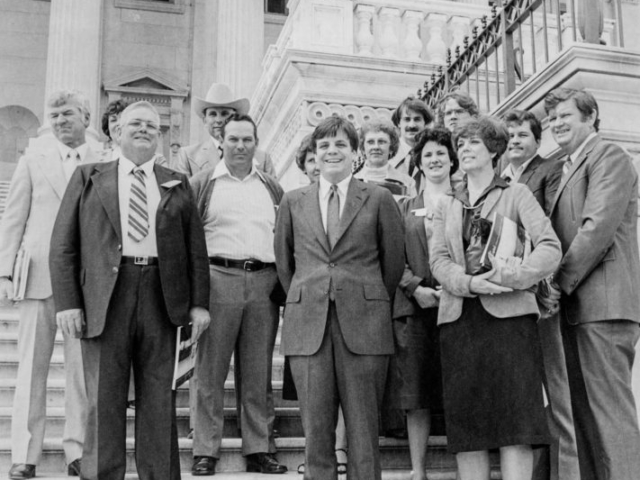This group of Oklahoma Farm Bureau members traveled to Washington, D.C., in 1982 during the annual legislative tour where they met with Rep. Mike Synar on the front steps of the Capitol building. From left to right are Richard and Carol Linihan of Oologah, Albert Lee of Pryor, Gary Fisher of Tahlequah, Dick and Clara Sheffield of Fort Gibson, Rep. Synar, Ima Landrum of Tulsa, Robin Landrum of Tulsa, Karen Leeds of Fort Gibson, Randy Moore of Inola, Gayle Perry of Fort Gibson, Larry Leeds of Fort Gibson and Arlie Perry of Fort Gibson.