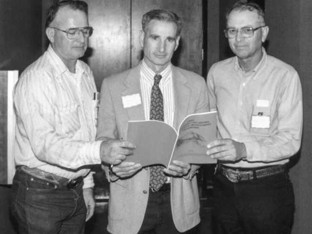 In 1993, boll weevil problems were a popular topic among farmers. In order to provide farmers and legislators with information concerning boll weevil eradication, Stephens County Farm Bureau held a meeting in late March at the Red River Vo-Tech. Pictured here is Oklahoma Sen. Larry Lawler, center, looking over boll weevil eradication facts with Stephens County President Bill Nunley (left) and Oklahoma Farm Bureau Board Member Ralph Dickson. Lawler was the Vice Chairman of the Senate Agriculture Committee.