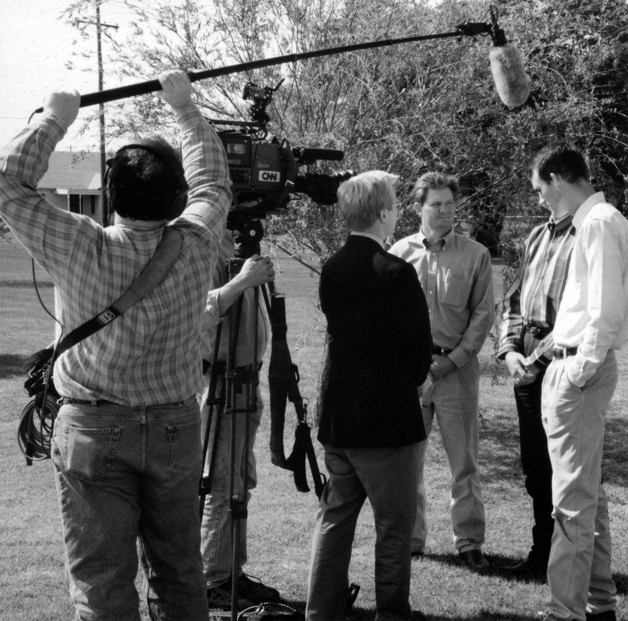 In this photo, CNN Newsman David Steck interviews OKFB Young Farmers & Ranchers members Tom Null, Keeff Felty and Matt Muller about weather forecasting’s impact on farming. The CNN crew was in Oklahoma on April 21, 1998, to videotape a story on severe weather awareness, and quizzed the YF&R members about any folklore-type indicators farmers recognized as precursors of storms.