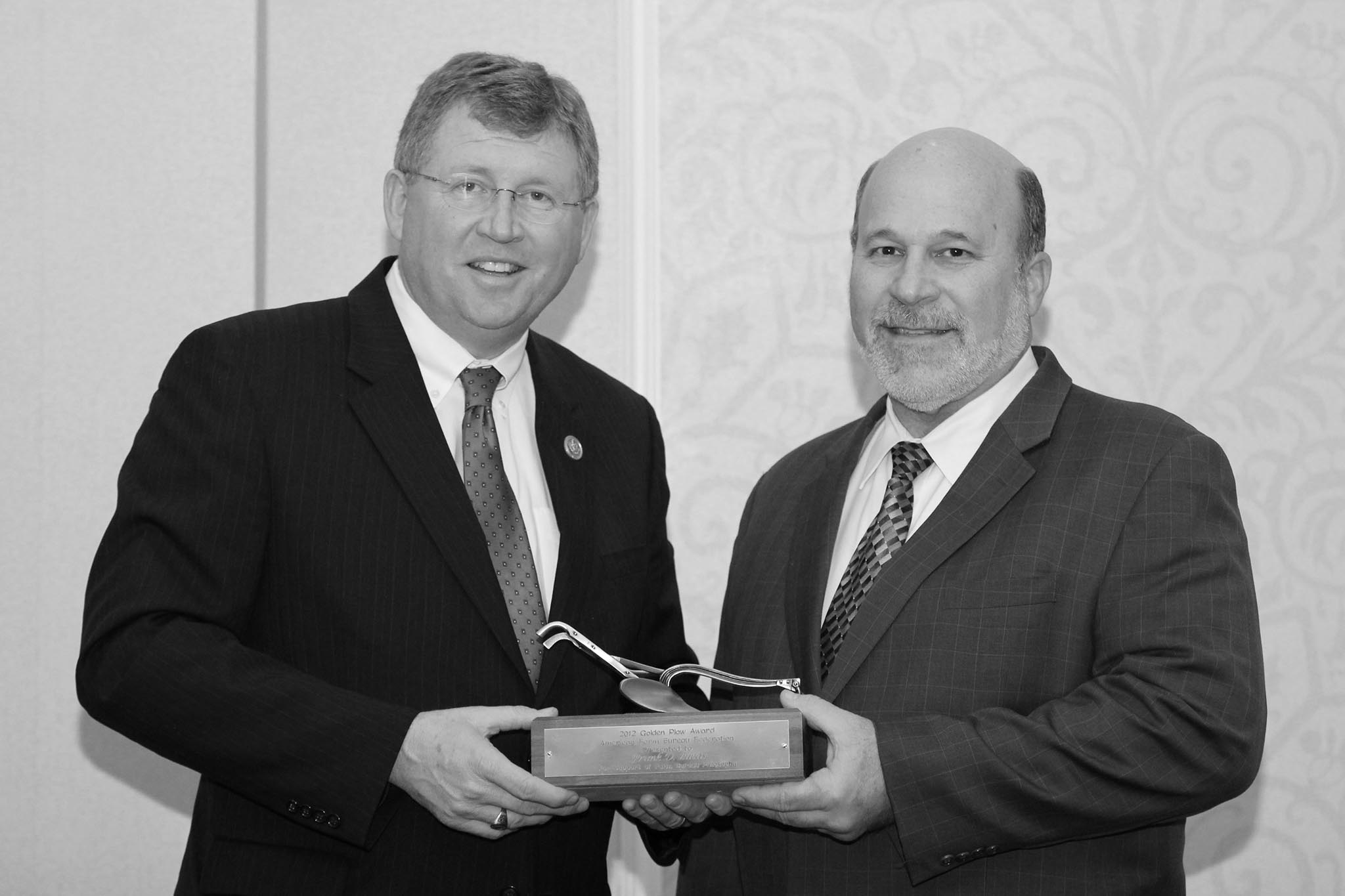 A longtime Oklahoma Farm Bureau member, U.S. Rep. Frank Lucas of Roger Mills County (left) received the 2012 American Farm Bureau Federation’s Golden Plow award from AFBF President Bob Stallman at the 2013 OKFB Legislative Leadership Conference. Lucas was recognized for his work on researching and developing the next farm bill. The Golden Plow is the highest honor AFBF bestows upon congressional leaders, recognizing members of Congress who exemplify agricultural leadership and support of Farm Bureau policies. Recipients are chosen for having a philosophy or record that demonstrates a commitment to sound agricultural policies supported by Farm Bureau, the private enterprise system, fiscal conservatism and reduced federal regulation of businesses and individuals.