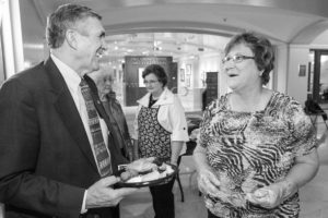 Here, Sen. Ron Justice of Chickasha (left) visits with Caddo County Farm Bureau’s Linda Taggart at the state capitol during the 2013 Farm City Festival held April 23.