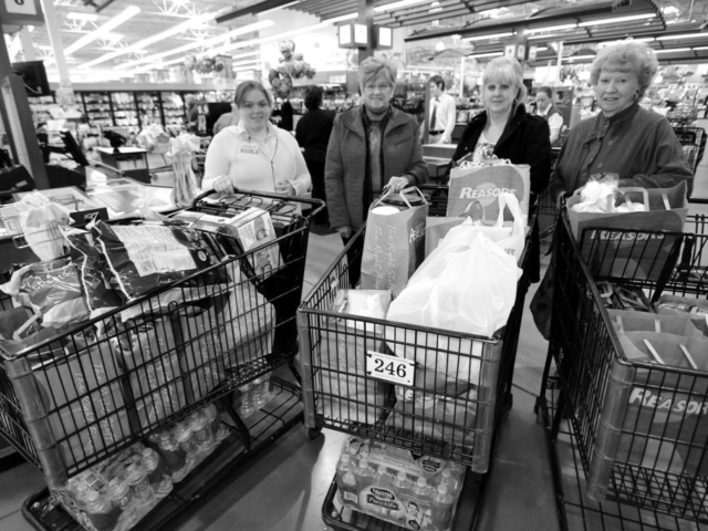 Connecting consumers with food and agriculture information is the goal of the long-running food donation efforts the Oklahoma Farm Bureau Women’s Leadership Committee has undertaken through Food Check-Out Day, and later, Our Food Link activities. As part of the program, OKFB WLC members purchase food and gift certificates to donate to the Ronald McDonald House Charities in Oklahoma City and Tulsa, providing families who have a child receiving treatment at nearby hospitals with a myriad of food choices during their stay. In this 2014 Our Food Link photo, OKFB WLC members Beverly Delmedico (right) and Lena Henson (second from left) shop for food to donate at a Tulsa-area Reasor’s store with OKFB WLC Coordinator Marcia Irvin (second from right). Also pictured is a member of the Reasor’s staff who helped the WLC members.