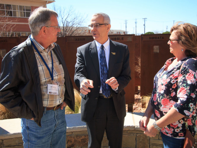 Oklahoma Secretary of Agriculture Jim Reese (center) visits with Farm Bureau members during the commemorative courtyard dedication on March 7, 2017.